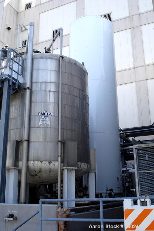 Used: Four Corp tank, approximately 6000 gallon, 316L stainless steel, vertical. Approximately 10' diameter x 11'6" straight side, dished top and bottom. Internal rated 10 psi at 150 deg.f.. Mounted ...