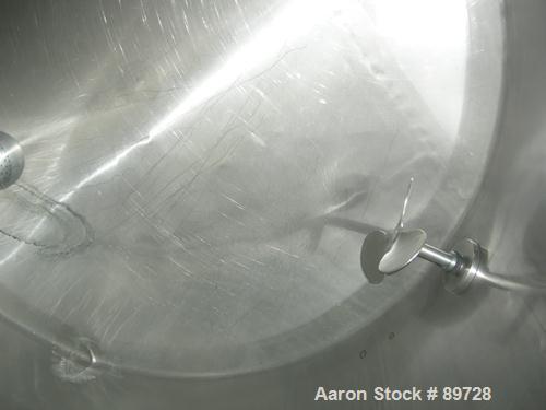 USED: G & F Manufacturing tank, 1000 gallon, 304 stainless steel, vertical. 74" diameter x 58" straight side, slight coned top, sloped bottom. Side bottom 3 blade agitator, driven by a 1 hp, 3/60/208...
