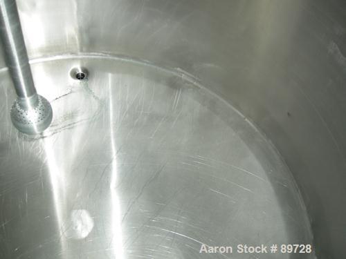 USED: G & F Manufacturing tank, 1000 gallon, 304 stainless steel, vertical. 74" diameter x 58" straight side, slight coned top, sloped bottom. Side bottom 3 blade agitator, driven by a 1 hp, 3/60/208...