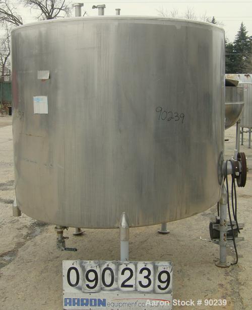 USED: G & F Manufacturing tank, 1000 gallon, 304 stainless steel, vertical. 74" diameter x 58" straight side, slight coned top, sloped bottom. Side bottom 3 blade agitator, driven by a 1 hp, 3/60/208...