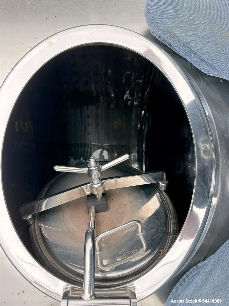 Used Glacier Tanks Stainless Steel Brew Tank, 40 BBL (1,240 Gallon). 304 stainless steel. Cone bottom. Center bottom outlet. Side manway. On (4) legs. SN GT-V-3215.