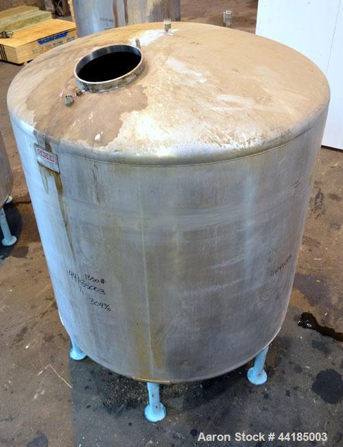 Used Groen Tank, 2500 Gallons, 304 Stainless Steel, Vertical. 90” Diameter x 78” straight side, dished top and bottom. Openings top (2) 1-5/8” threaded, 2-1/2” threaded, 15-3/4” man way, no cover. 2”...