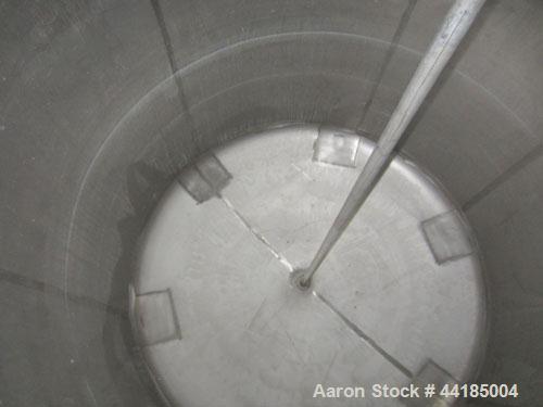 Used Groen Tank, 2500 Gallons, 304 Stainless Steel, Vertical. 90” Diameter x 78” straight side, dished top and bottom. Openings top (2) 1-5/8” threaded, 2-1/2” threaded, 15-3/4” man way with cover. 2...