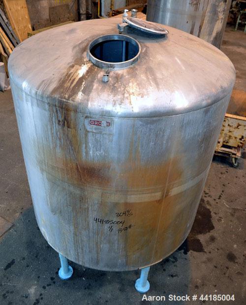 Used Groen Tank, 2500 Gallons, 304 Stainless Steel, Vertical. 90” Diameter x 78” straight side, dished top and bottom. Openings top (2) 1-5/8” threaded, 2-1/2” threaded, 15-3/4” man way with cover. 2...