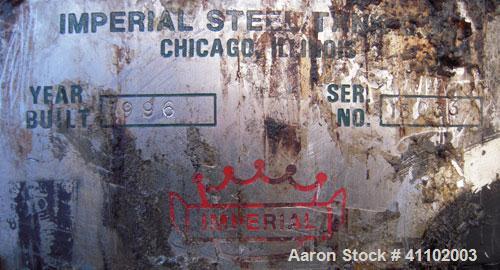 Used Imperial Steel Tank Company Tank, 1800 gallon, 304 stainless steel, vertical. 72" diameter x 96" straight side. Flat bolt on top with a 1/4 hinged cover, dish bottom. Top carbon steel agitator b...