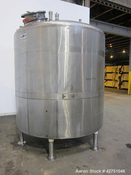 Used Langsenkamp Tank, 2000 Gallon, 304 Stainless Steel, Vertical. 84" Diameter x 78" straight side, dished top, coned bottom. Off center top entering Lightnin agitator, model N33G-90. 1-1/2" Diamete...