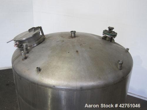 Used Langsenkamp Tank, 2000 Gallon, 304 Stainless Steel, Vertical. 84" Diameter x 78" straight side, dished top, coned bottom. Off center top entering Lightnin agitator, model N33G-90. 1-1/2" Diamete...