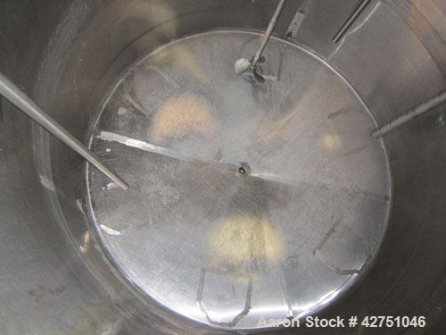 Used Langsenkamp Tank, 2000 Gallon, 304 Stainless Steel, Vertical. 84" Diameter x 78" straight side, dished top, coned bottom. Off center top entering Lightnin agitator, model N33G-90. 1-1/2" Diamete...