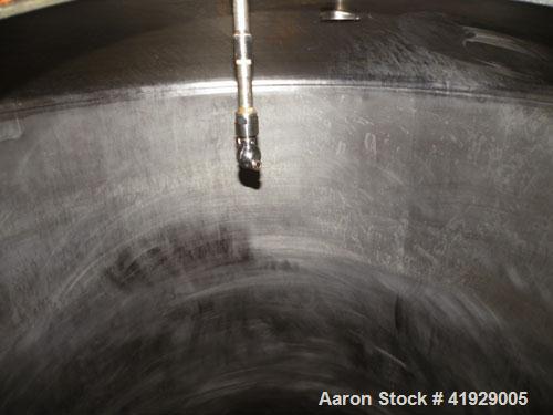 Used Lee Industries Tank, 2000 Gallon, model DBTT, stainless steel, vertical. 76" diameter x 106" straight side, dished top and bottom. Openings: top 3" tri-clamp, 4" tri-clamp, 4" vent, 24" manway w...