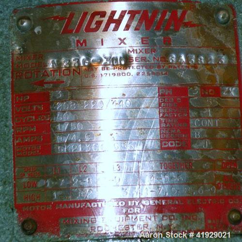 Used Lee Metal Products Tank, 2000 Gallon,  Stainless Steel, Vertical. 76" diameter x 106" straight side, dished top and bottom. Off center top entering Lightnin agitator, model N33G-300. 1-1/2" diam...