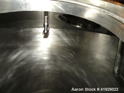 Used Lee Metal Products Tank, 2000 Gallon, Stainless Steel, Vertical. 76" diameter x 106" straight side, dished top and bottom. Openings top (2) 3" tri-clamp, 4" vent, (2) 20" manway with cover, side...