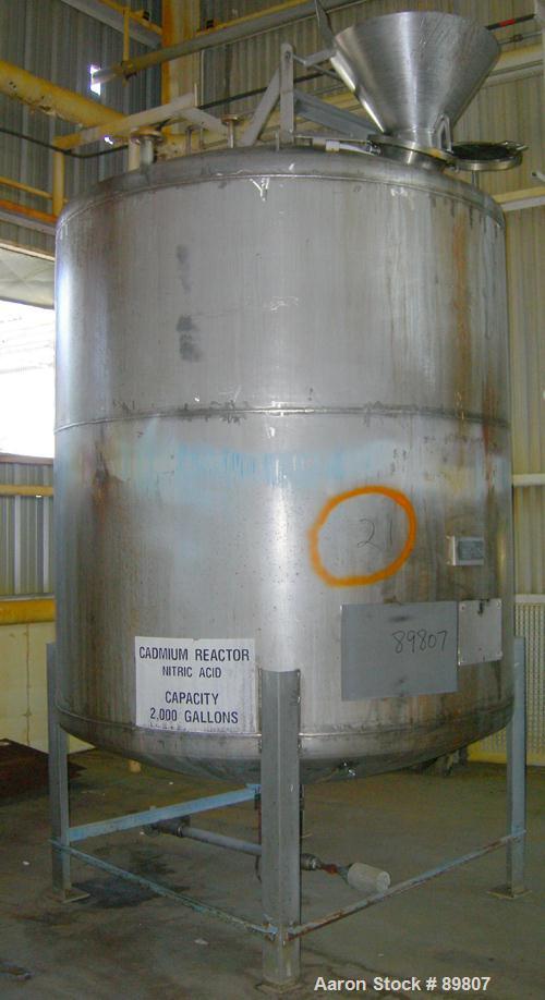 USED: Approximate 2,000 gallon stainless steel tank built by Metal Equipment Co. Dished heads. Approximately 6'8" diameter x 7' straight side. Mounted on 4 I-beam legs. 2" CBO. Built 1983.