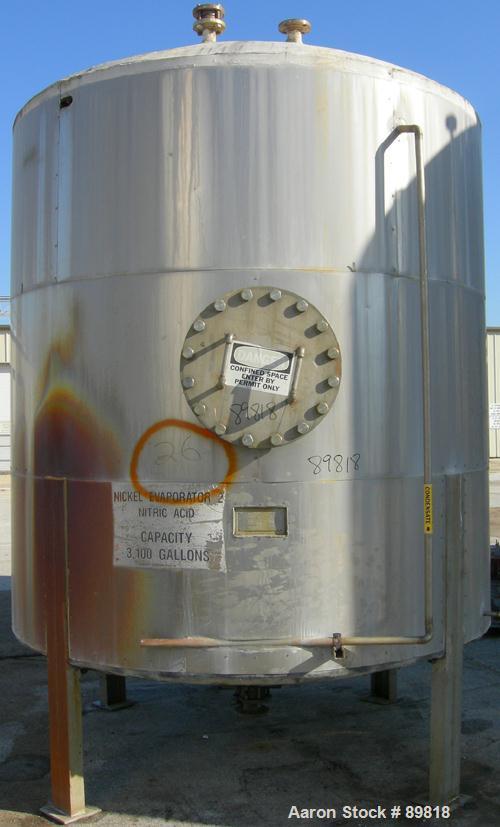 USED: Metal Equipment tank, approximately 3000 gallon, stainless steel. Insulated. 8' diameter x 8' straight side. Dish top, cone bottom. Side 18" manway with cover. Mounted on 4 stainless steel legs.