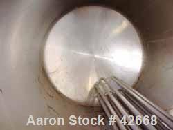 Used Mojonnier Tank, 1500 Gallon, Stainless Steel, Horizontal. Approximately 72" diameter x 101" straight side, dished ends. Insulated, carbon steel shell. End bottom bayonette style pipe heater. Ope...