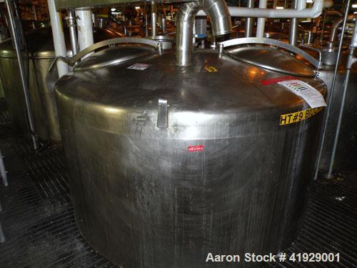 Used Mueller Tank, 2000 Gallon, Model F, Stainless Steel, Vertical. 76" diameter x 106" straight side, dished top and bottom. Openings top (2) 3" tri-clamp, 4" vent, (2) 24" manways with covers. Appr...