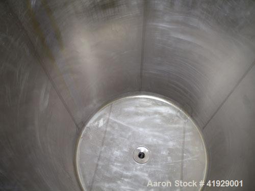 Used Mueller Tank, 2000 Gallon, Model F, Stainless Steel, Vertical. 76" diameter x 106" straight side, dished top and bottom. Openings top (2) 3" tri-clamp, 4" vent, (2) 24" manways with covers. Appr...