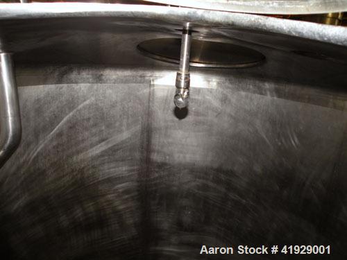 Used Mueller Tank, 2000 Gallon, Model F, Stainless Steel, Vertical. 76" diameter x 106" straight side, dished top and bottom. Openings top (2) 3" tri-clamp, 4" vent, (2) 24" manways with covers. Appr...