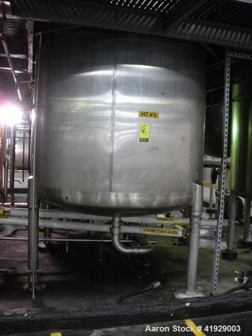 Used Mueller Tank, 2000 Gallon, Model F, Stainless Steel, Vertical. 76" diameter x 106" straight side, dished top and bottom. Openings top (3) 3" tri-clamp, 4" vent, 8" drive (capped), 24" manway wit...