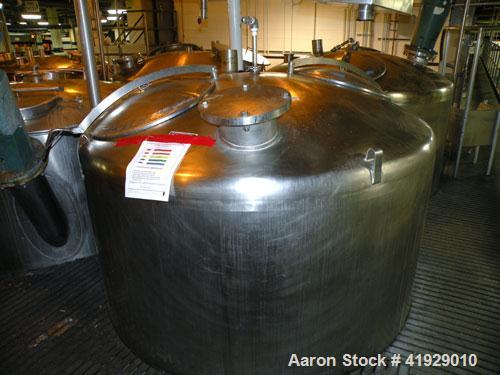 Used Mueller Tank, 2000 Gallon, Model F, Stainless Steel, Vertical. 76" diameter x 106" straight side, dished top and bottom. Openings top 2" tri-clamp, 3" tri-clamp, 4" vent, 8" drive (capped), (2) ...