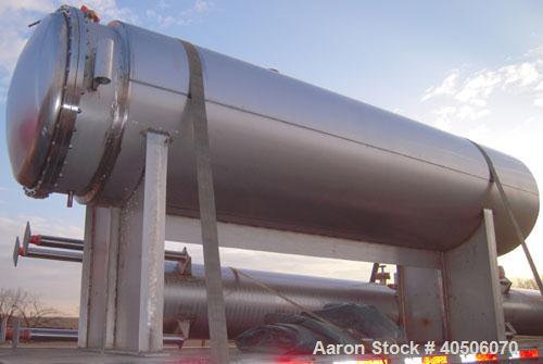 Unused- Mueller Coalescer Pressure Tank, 1600 Gallon, Model "H", 304L atainless steel, horizontal. 48" diameter x 204" straight side, (1) dished bolt on end with davit arm, (1) dished end. Internal r...