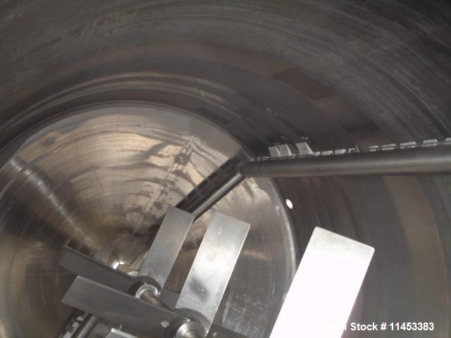 Used 3000 Gallon Mueller Twin Motion Processor. 316 stainless steel construction. 90" diameter x 107" straight side, dish top, 27" deep cone bottom. Jacketed on bottom and up straight side for 90 psi...