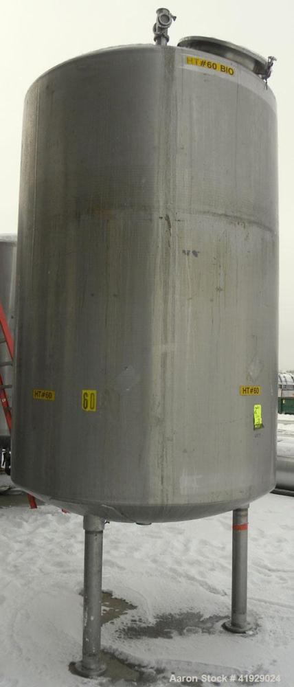 Used Mueller Tank, 2000 Gallon, 316 Stainless Steel, Vertical. 76" diameter x 106" straight side, dished top and bottom. (1) Spray nozzle. Openings top (2) 3" tri-clamp, 4" vent, 8" drive (capped), 2...