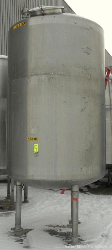 Used Mueller Tank, 2000 Gallon, 316 Stainless Steel, Vertical. 76" diameter x 106" straight side, dished top and bottom. (1) Spray nozzle. Openings top (2) 3" tri-clamp, 4" vent, 8" drive (capped), 2...