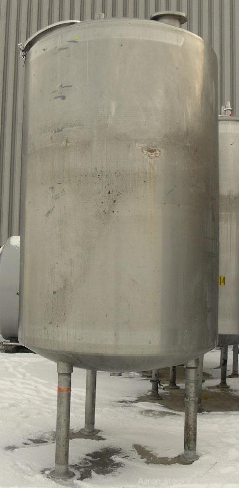 Used Mueller Tank, 2000 Gallon, 316 Stainless Steel, Vertical. 76" diameter x 106" straight side, dished top and bottom. (1) Spray nozzle. Openings top (2) 3" tri-clamp, 4" vent, 8" drive (capped), 2...