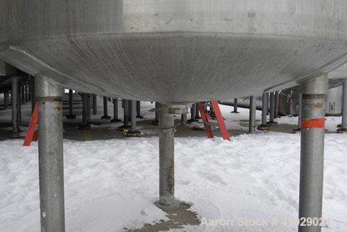 Used Mueller Tank, 2000 Gallon, 316 Stainless Steel, Vertical. 76" diameter x 106" straight side, dished top and bottom. (1) Spray nozzle. Openings top (2) 3" tri-clamp, 4" vent, 8" drive (capped), 2...