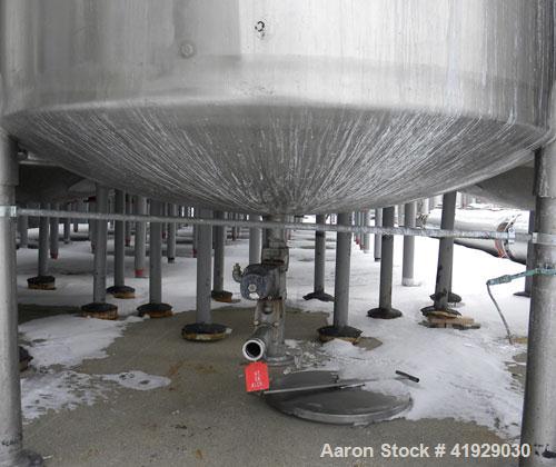 Used Mueller Tank, 2000 Gallon, Model F, 316 Stainless Steel, Vertical. 76" diameter x 106" straight side, dished top and bottom. Off center top entering angled Lightnin manual variable speed agitato...