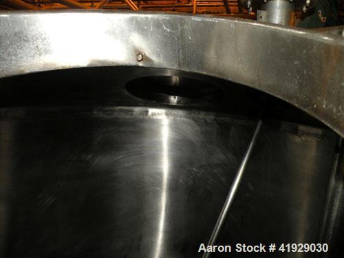 Used Mueller Tank, 2000 Gallon, Model F, 316 Stainless Steel, Vertical. 76" diameter x 106" straight side, dished top and bottom. Off center top entering angled Lightnin manual variable speed agitato...