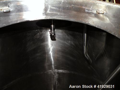 Used Mueller Tank, 2000 Gallon, Model F, Stainless Steel, Vertical. 76" diameter x 106" straight side, dished top and bottom. Off center top entering angled Lightnin manual variable speed agitator, m...