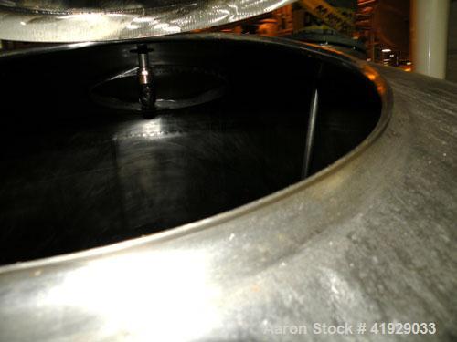 Used Mueller Tank, 2000 Gallon, Model F, stainless steel, vertical. 76" diameter x 106" straight side, dished top and bottom. Off center top entering angled Lightnin agitator, model N33G-300. 1-1/2" ...
