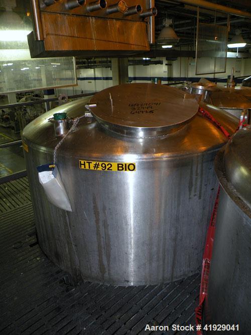 Used Mueller Tank, 2000 Gallon, stainless steel, vertical. 76" diameter x 106" straight side, dished top and bottom. Openings: top 3" tri-clamp, 4" tri-clamp, 4" vent, 8" drive (capped), 24" manway w...