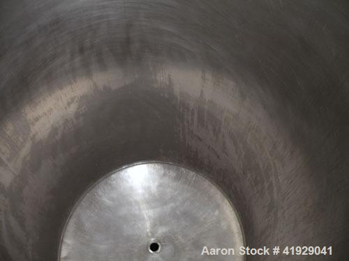 Used Mueller Tank, 2000 Gallon, stainless steel, vertical. 76" diameter x 106" straight side, dished top and bottom. Openings: top 3" tri-clamp, 4" tri-clamp, 4" vent, 8" drive (capped), 24" manway w...