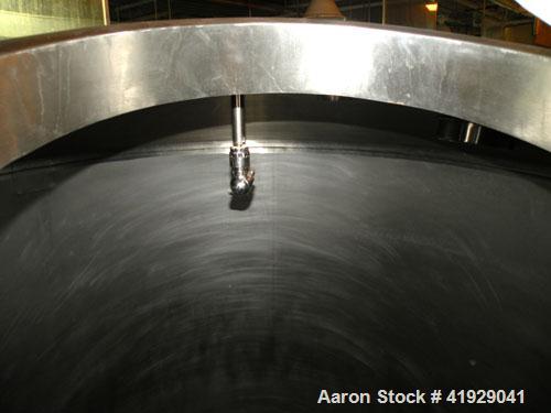 Used Mueller Tank, 2000 Gallon, stainless steel, vertical. 76" diameter x 106" straight side, dished top and bottom. Openings: top 3" tri-clamp, 4" tri-clamp, 4" vent, 8" drive (capped), 24" manway w...