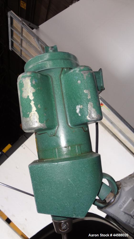 Used Mueller Tank, 1000 Gallons, 316 Stainless Steel, Vertical.  Approximately 76" diameter x 57" straight side, open top with (2) covers, sloped bottom.  (2) Lightnin clamp-on agitators.  (1) Model ...