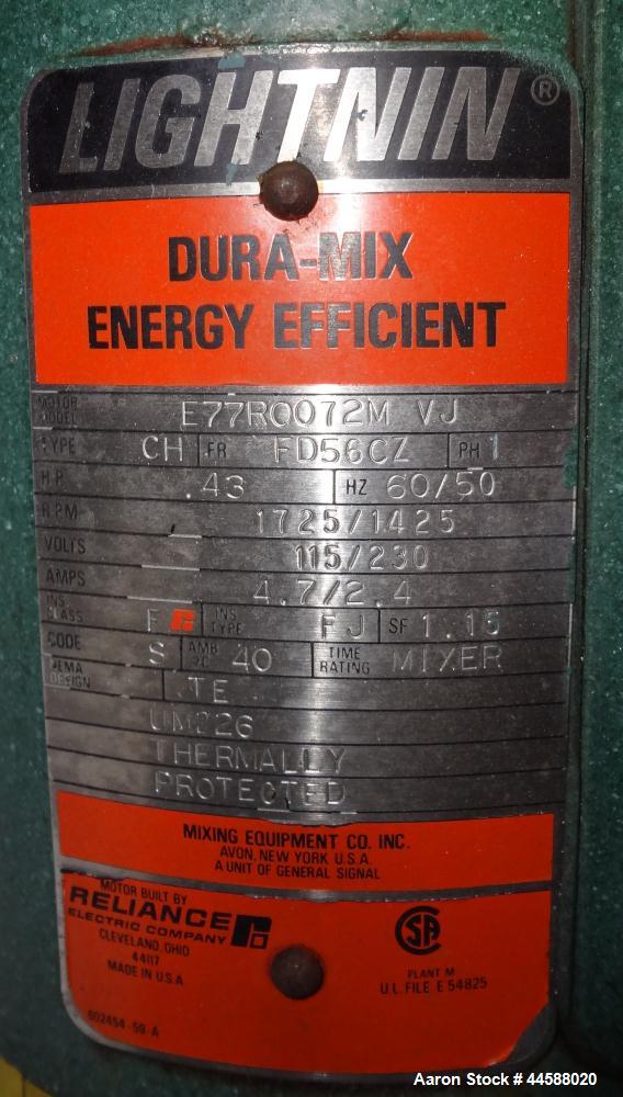 Used Mueller Tank, 1000 Gallons, 316 Stainless Steel, Vertical.  Approximately 76" diameter x 57" straight side, open top with (2) covers, sloped bottom.  (2) Lightnin clamp-on agitators.  (1) Model ...