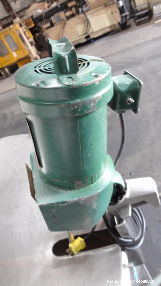 Used Mueller Tank, 1000 Gallons, 316 Stainless Steel, Vertical.  Approximately 76" diameter x 57" straight side, open top with (2) covers, sloped bottom.  (2) Lightnin clamp-on agitators.  (1) Model ...