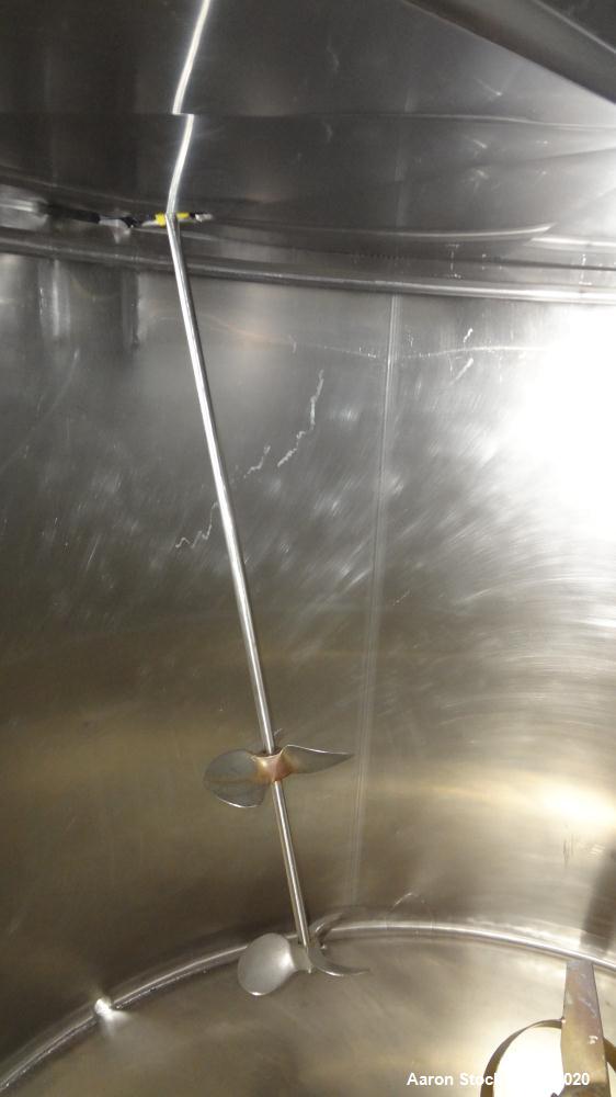 Used Mueller Tank, 1000 Gallons, 316 Stainless Steel, Vertical.  Approximately 76" diameter x 57" straight side, open top with (2) covers, sloped bottom.  (2) Lightnin clamp-on agitators.  (1) Model ...