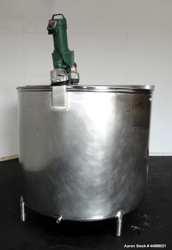 Used Mueller Tank, 1000 Gallon, 316 Stainless Steel, Vertical. Approximate 76” diameter x 57” straight side, open top with (2) covers, sloped bottom. (2) Lightnin clamp on agitators. (1) Model XJ-65V...
