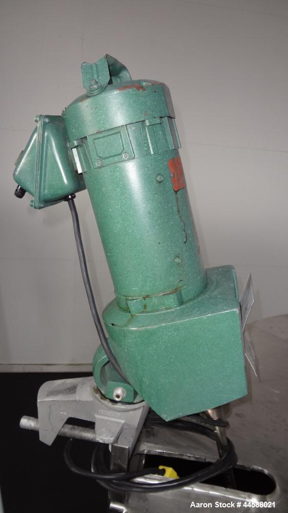 Used Mueller Tank, 1000 Gallon, 316 Stainless Steel, Vertical. Approximate 76” diameter x 57” straight side, open top with (2) covers, sloped bottom. (2) Lightnin clamp on agitators. (1) Model XJ-65V...