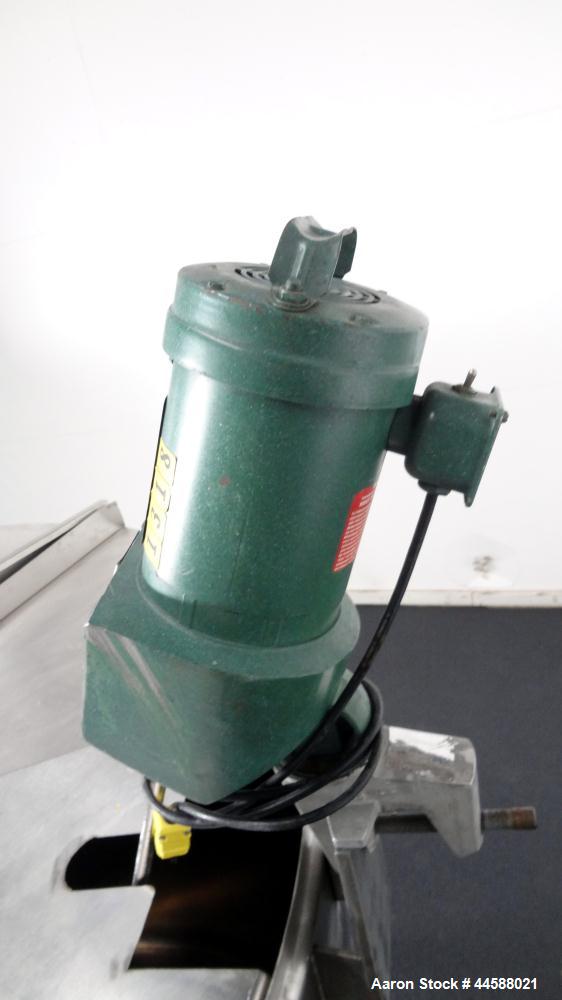 Used Mueller Tank, 1000 Gallon, 316 Stainless Steel, Vertical. Approximate 76” diameter x 57” straight side, open top with (2) covers, sloped bottom. (2) Lightnin clamp on agitators. (1) Model XJ-65V...