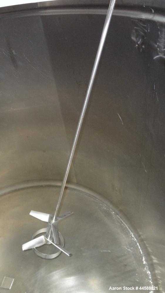 Used Mueller Tank, 1000 Gallon, 316 Stainless Steel, Vertical. Approximate 76” diameter x 57” straight side, open top with (2) covers, sloped bottom. (2) Lightnin clamp on agitators. (1) Model XJ-65V...