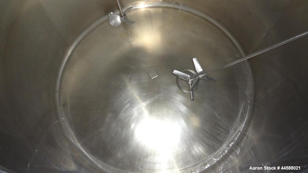 Used Mueller Tank, 1000 Gallon, 316 Stainless Steel, Vertical. Approximate 76” diameter x 57” straight side, open top with (2) covers, sloped bottom. (2) Lightnin clamp on agitators. (1) Model XJ-65V...