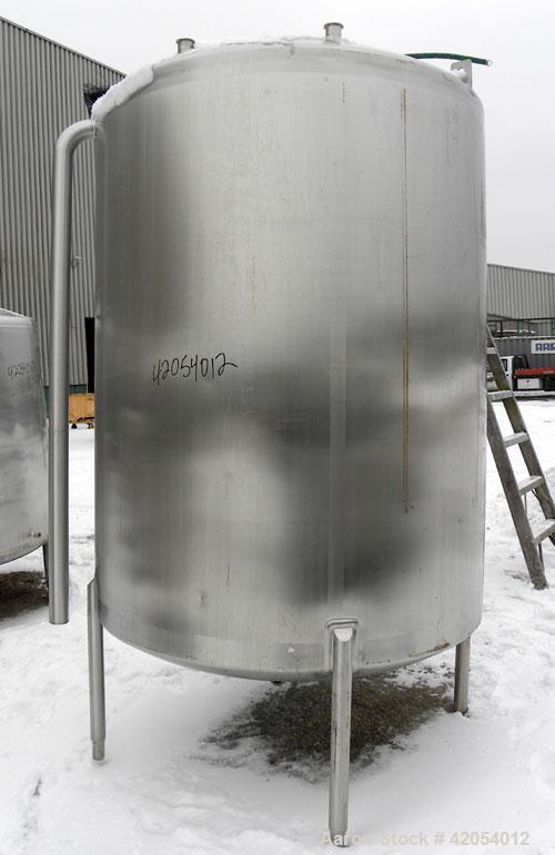 Used Lake Process Systems Tank, 1000 Gallon, Model LPS-1000, 304 Stainless Steel, Vertical. 60" diameter x 72" straight side, dish top and bottom. (1) Spray ball. Openings top (3) 2", 1-1/2", 19" man...