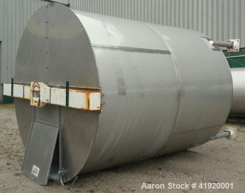 Used Tank, 4200 Gallon, 304 Stainless Steel, Vertical. 100" diameter x 120" straight side, flat open top with a bolt on cover with a hinged access door, coned bottom. Bolt on carbon steel agitator br...