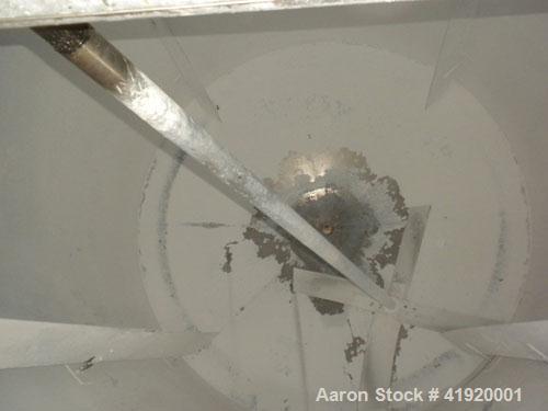 Used Tank, 4200 Gallon, 304 Stainless Steel, Vertical. 100" diameter x 120" straight side, flat open top with a bolt on cover with a hinged access door, coned bottom. Bolt on carbon steel agitator br...