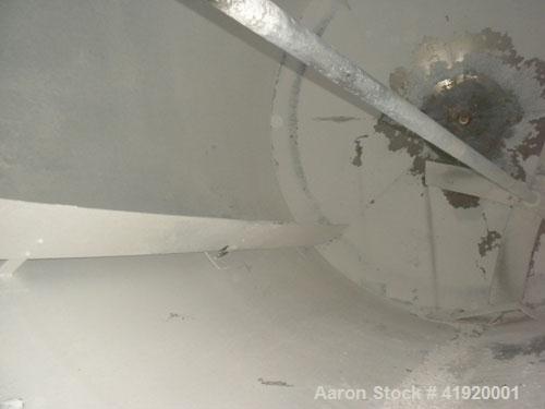 Used Tank, 4200 Gallon, 304 Stainless Steel, Vertical. 100" diameter x 120" straight side, flat open top with a bolt on cover with a hinged access door, coned bottom. Bolt on carbon steel agitator br...