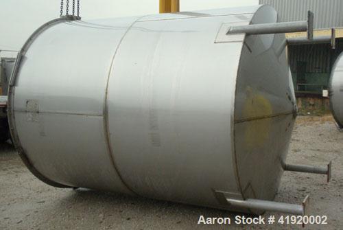 Used Tank, 4200 Gallon, 304 Stainless Steel, Vertical. 100" diameter x 120" straight side, flat open top with a bolt on cover with a hinged access door, coned bottom. Bolt on carbon steel agitator br...